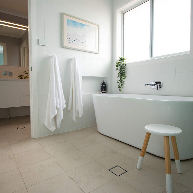Bathroom with tiled floors and walls
