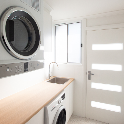 Renovated laundry with washer under the sink